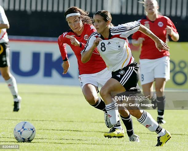 Sandra Smisek of Germany and Ingvild Stensland of Norway run for the ball during the Women's international friendly match between Norway and Germany...