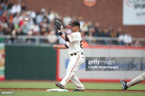 Travis Denker of the San Francisco Giants catches the ball for a force out at second base during the game against the San Diego Padres at AT&T Park...