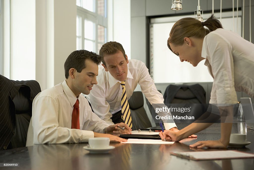 Business people discussing at conference table 