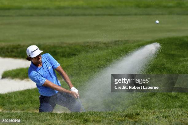 Puma Dominguez of Argentina makes a shot out of a bunker on the eight hole during round two of the Web.com Tour Pinnacle Bank Championship on July...