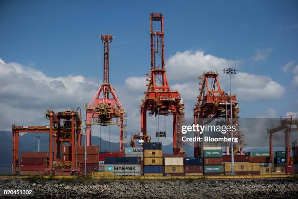 Gantry cranes stand over shipping containers at the Port of Vancouver in Vancouver, British Columbia, Canada, on Tuesday, July 11, 2017. Statistics...