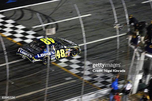 Auto Racing: NASCAR UAW-GM Quality 500, Aerial view of Jimmie Johnson in action, taking checkered flag, crossing finish line, and winning race at...