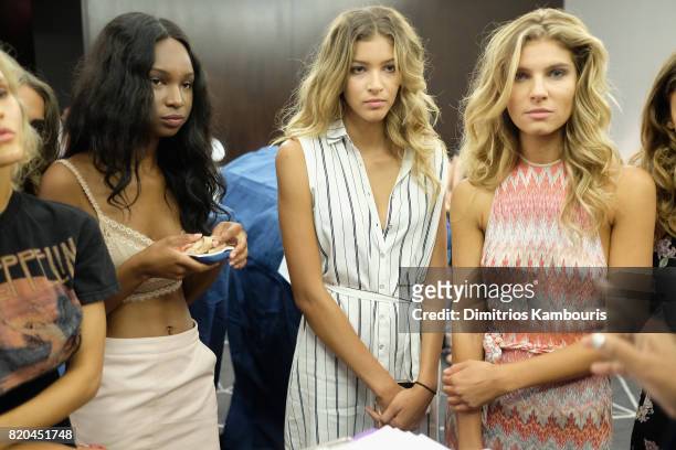 Models prepare backstage during the SWIMMIAMI Hammock 2018 Collection fashion show at WET Deck at W South Beach on July 21, 2017 in Miami Beach,...