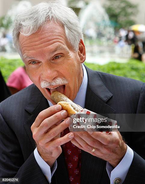 Agriculture Secretary Edward Schafer takes a bite of a Hatfield brand Nationals Sausage during the American Meat Institute's Annual Hot Dog Day Lunch...