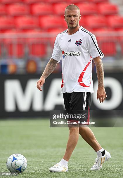 Midfielder David Beckham of L.A. Galaxy with the ball during a MLS All Star training session before the MLS All Star Game at BMO Field on July 23,...