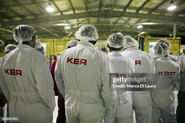 Employees work at a manufacturing plant at the Camp Bastion Water Bottling Plant on July 21, 2008 at the British Army base in Camp Bastion in the...