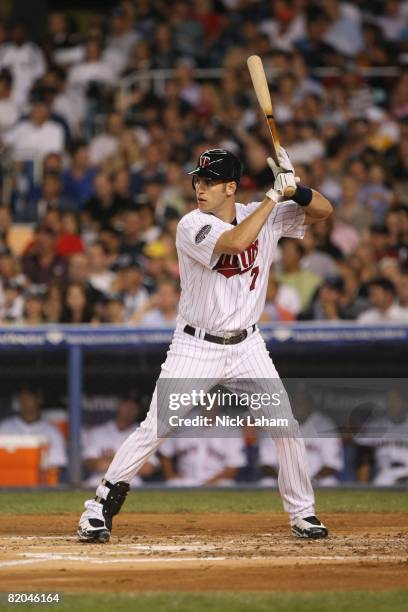 Joe Mauer of the American League All-Stars at bat against the National League All-Stars during the 79th MLB All-Star Game at Yankee Stadium on July...