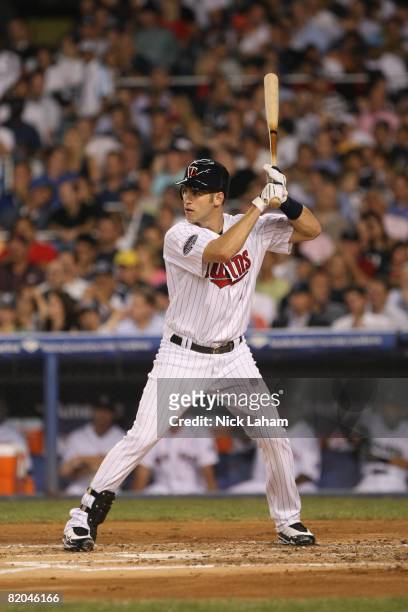 Joe Mauer of the American League All-Stars at bat against the National League All-Stars during the 79th MLB All-Star Game at Yankee Stadium on July...