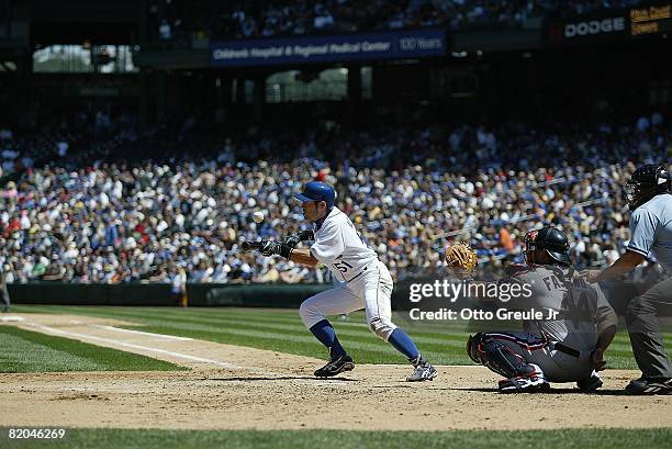 Ichiro Suzuki of the Seattle Mariners bunts against the Cleveland Indians on July 19, 2008 at Safeco Field in Seattle, Washington.