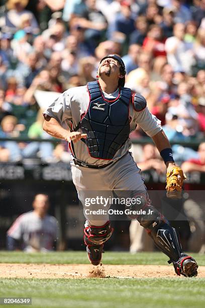 Sal Fasano of the Cleveland Indians gets under a pop up against the Seattle Mariners on July 19, 2008 at Safeco Field in Seattle, Washington.