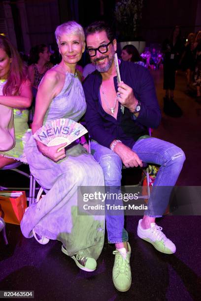 Alex Jolig and his wife Britt Jolig-Heinz attend the Breuninger show during Platform Fashion July 2017 at Areal Boehler on July 21, 2017 in...