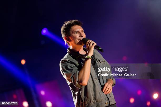 Singer Julian Heidrich aka Julian le Play performs on stage during the rehearsal for the 'Starnacht am Woerthersee' at Woertherseebuehne on July 21,...