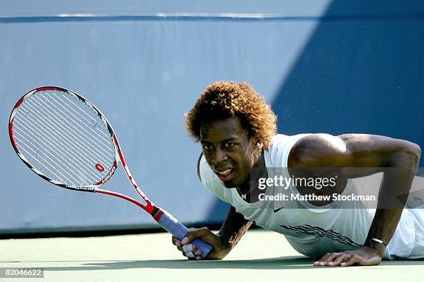 Gael Monfils of France falls to the court while playing Igor Andreev of Russia during the Rogers Cup at the Rexall Centre at York University July 22,...