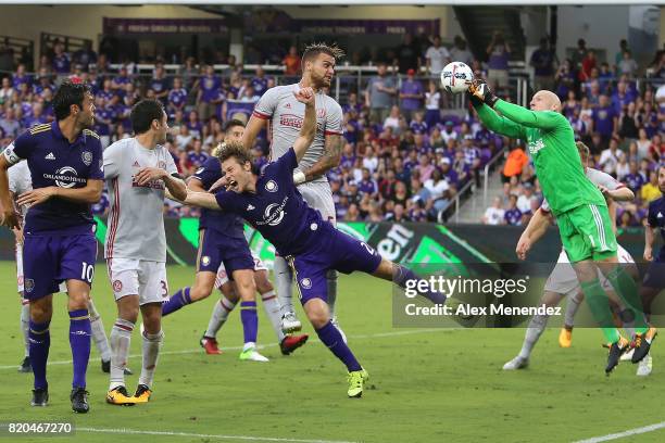 Goalkeeper Brad Guzan of Atlanta United makes a save against Jonathan Spector of Orlando City SC during a MLS soccer match between Atlanta United FC...