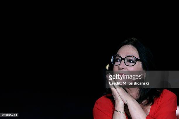 Greek singer Nana Mouskouri performs during a tribute concert at the restored ancient stone theater Odeon of Herodes Atticus, on July 23, 2008 in...