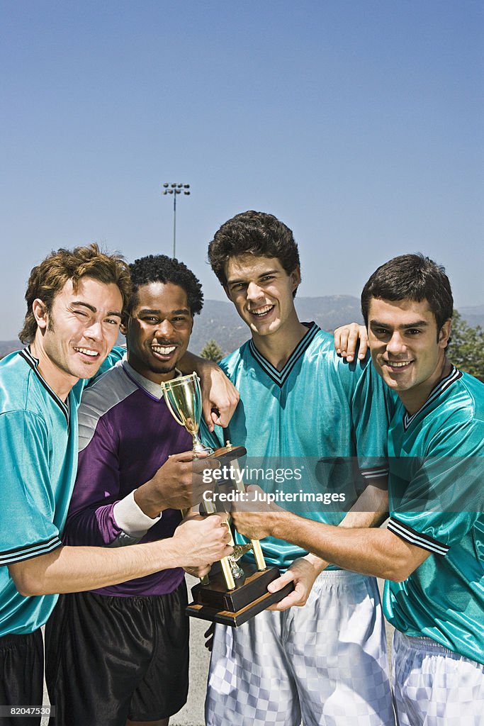 Winning soccer team with trophy