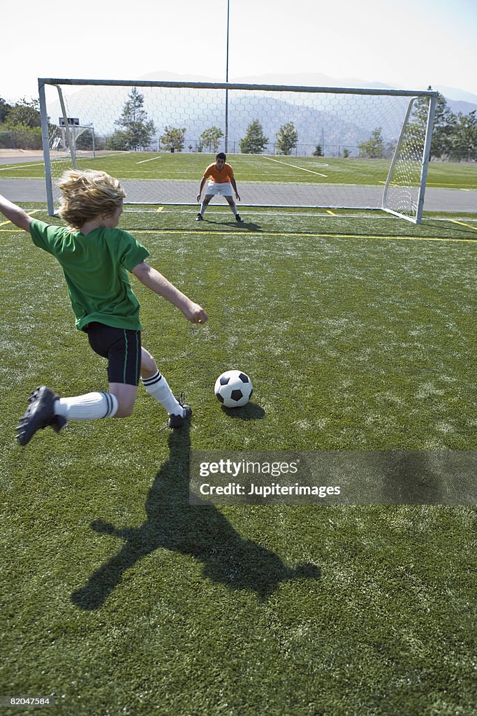 Soccer player attempting goal