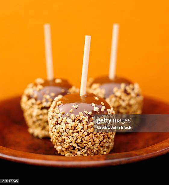 three caramel apples - caramel block stock pictures, royalty-free photos & images
