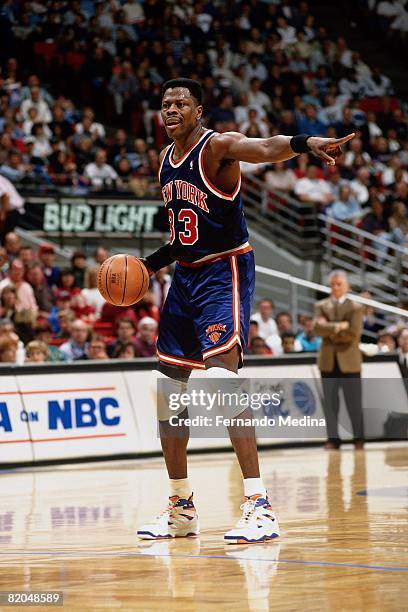 Patrick Ewing of the New York Knicks poins as he handles the ball during a game against the Orlando Magic at TD Waterhouse Centre on February 5, 1995...