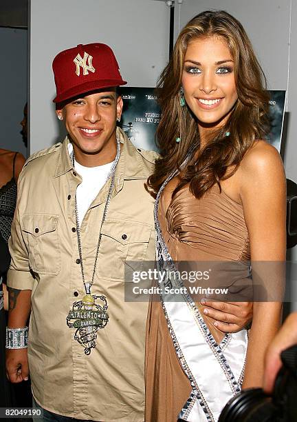 Musician Daddy Yankee and Miss Universe 2008 Dayana Mendoza attend the premiere of "Talento de Barrio" during the 9th Annual New York International...