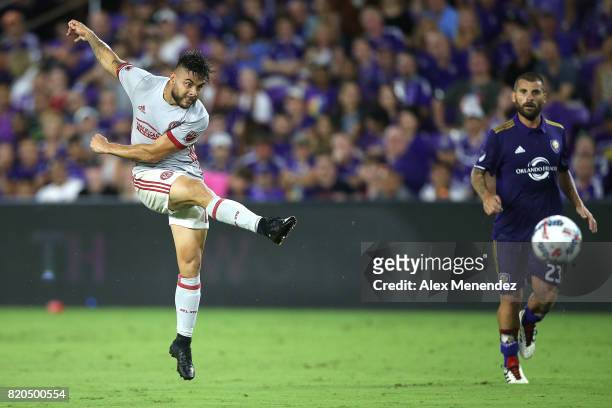 Hector Villalba of Atlanta United scores a goal in front of Antonio Nocerino of Orlando City SC during a MLS soccer match between Atlanta United FC...