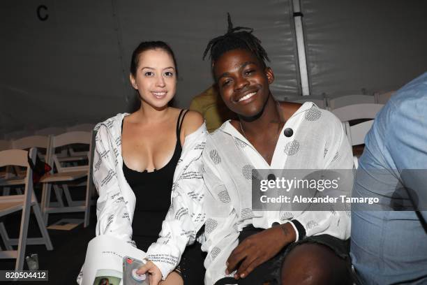 Milena Oyarzun and Paxton Ingram attend the SWIMMIAMI Prey Swim by Audrina Patridge Resort 2018 Collection fashion show at The Tent on July 21, 2017...