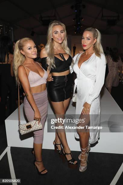 Kay De Courval, Khloe Terae and Katie Carpenter attend the SWIMMIAMI Prey Swim by Audrina Patridge Resort 2018 Collection fashion show at The Tent on...