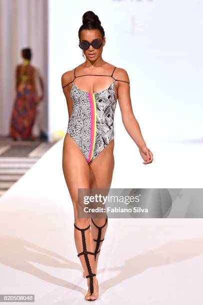 Model walks the runway during the Keva J Swimwear S/S 2018 fashion show at Loews Miami Beach Hotel on July 21, 2017 in Miami Beach, Florida.