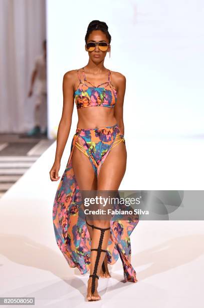 Model walks the runway during the Keva J Swimwear S/S 2018 fashion show at Loews Miami Beach Hotel on July 21, 2017 in Miami Beach, Florida.