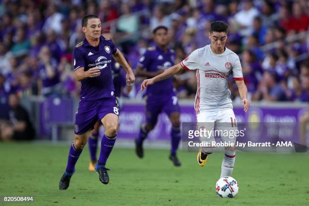Will Johnson of Orlando City and Miguel Almiron of Atlanta United during the MLS match between Atlanta United and Orlando City at Orlando City...