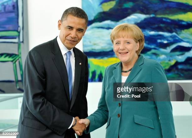Democratic presidential candidate Sen. Barack Obama shakes hands with German Chancellor Angela Merkel at the Chancellery on July 24, 2008 in Berlin,...