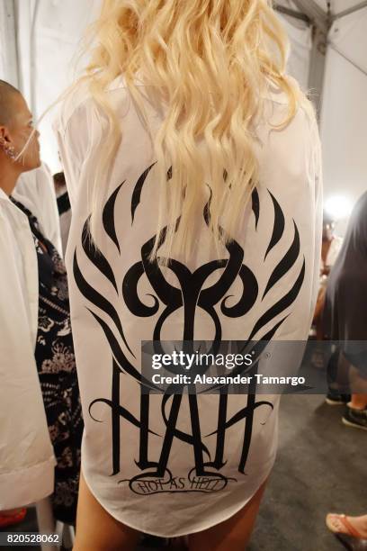 Model prepares backstage during SWIMMIAMI Hot-As-Hell 2018 Collection at 227 22nd Street on July 21, 2017 in Miami Beach, Florida.