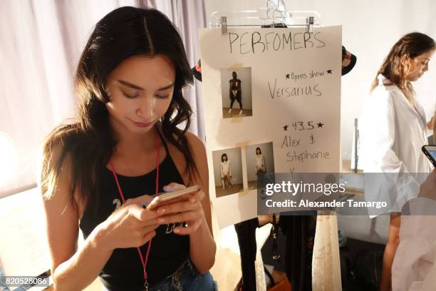 Model prepares backstage during SWIMMIAMI Hot-As-Hell 2018 Collection at 227 22nd Street on July 21, 2017 in Miami Beach, Florida.