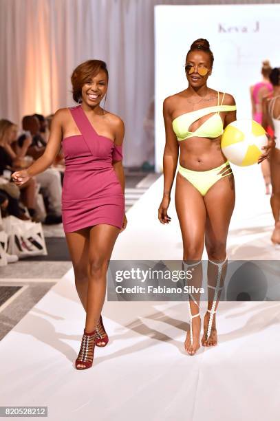 Keva Johnson and Eva Marcille walk the runway during the Keva J Swimwear S/S 2018 fashion show at Loews Miami Beach Hotel on July 21, 2017 in Miami...