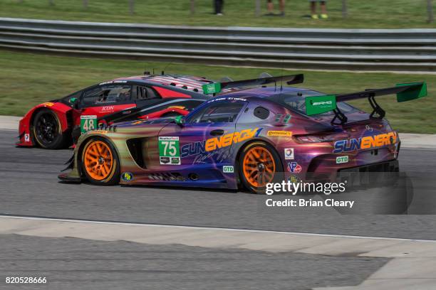 The Mercedes AMG GT3 of Tristan Vaultier, of France, and Kenny Habul races with the Lamborghini Huracan GT3 of Madison Snow and Bryan Sellers during...