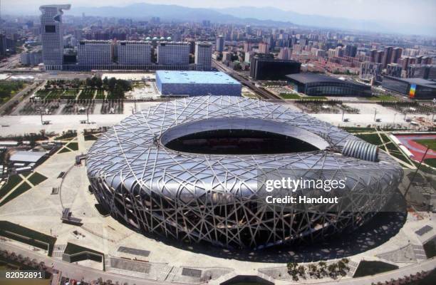 In this photo released by the Beijing Tourism Administration, China's National Stadium, known as the Bird's Nest and the National Aquatics Center,...