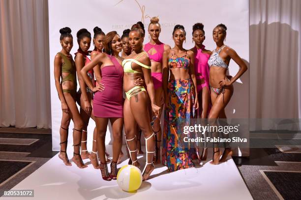 Keva Johnson and Eva Marcille pose with models during the Keva J Swimwear S/S 2018 fashion show at Loews Miami Beach Hotel on July 21, 2017 in Miami...