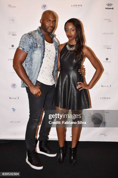 Toren Dain Valimar and guest attend the Keva J Swimwear S/S 2018 fashion show at Loews Miami Beach Hotel on July 21, 2017 in Miami Beach, Florida.