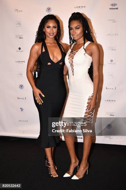 Darnell Nicole and Ashley Wheeler attend the Keva J Swimwear S/S 2018 fashion show at Loews Miami Beach Hotel on July 21, 2017 in Miami Beach,...