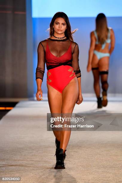 Model walks the runway during the SWIMMIAMI KAOHS 2018 Collection fashion show at WET Deck at W South Beach on July 21, 2017 in Miami Beach, Florida.