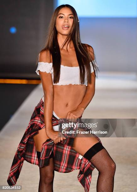 Model walks the runway during the SWIMMIAMI KAOHS 2018 Collection fashion show at WET Deck at W South Beach on July 21, 2017 in Miami Beach, Florida.