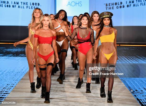 Models walk the runway during the SWIMMIAMI KAOHS 2018 Collection fashion show at WET Deck at W South Beach on July 21, 2017 in Miami Beach, Florida.