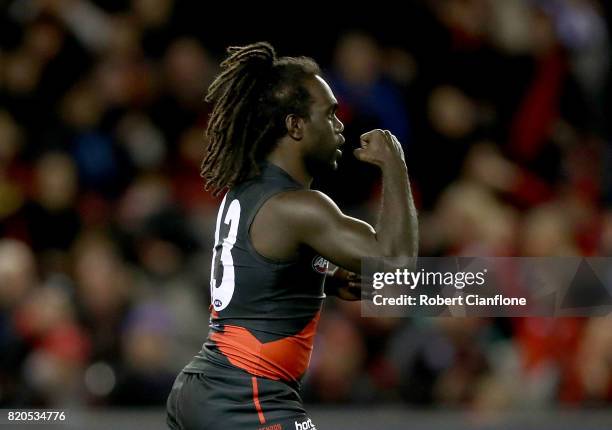 Anthony McDonald-Tipungwuti of the Bombers celebrates after scoring a goal during the round 18 AFL match between the Essendon Bombers and the North...