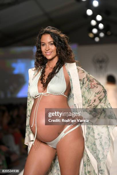 Model walks the runway at the SWIMMIAMI Hot-As-Hell 2018 Collection fashion show at 227 22nd Street on July 21, 2017 in Miami Beach, Florida.