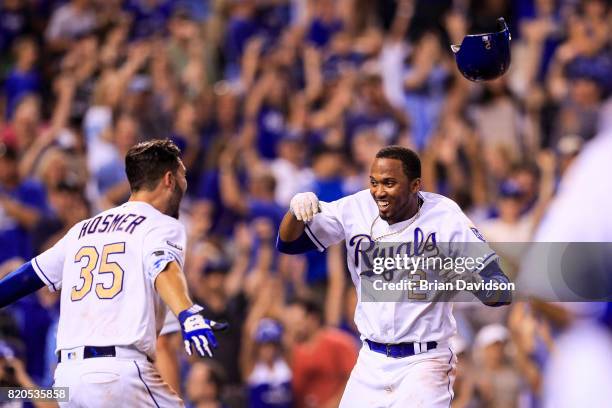 Alcides Escobar of the Kansas City Royals celebrates scoring the game winning run against the Chicago White Sox with Eric Hosmer in the tenth inning...