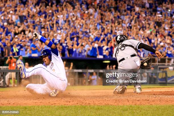 Alcides Escobar of the Kansas City Royals scores the game winning run against the Chicago White Sox during the tenth inning at Kauffman Stadium on...