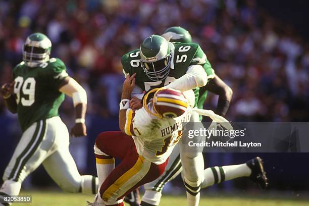 Byron Evans of the Philadelphia Eagles makes a sack during a NFL football game against Stan Humphries of the Washington Redskins on October 1, 1990...