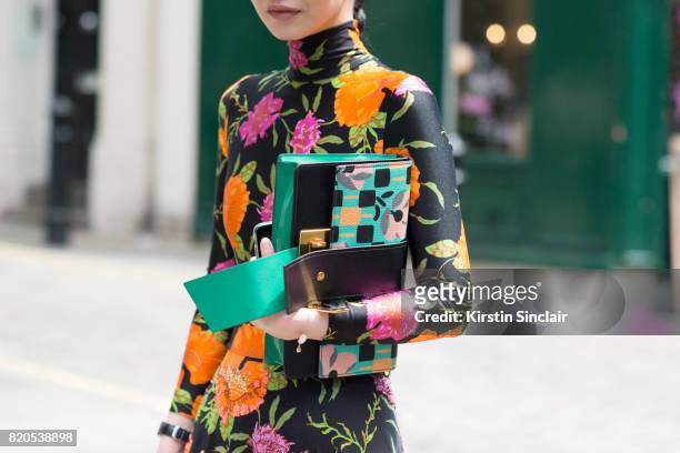Fashion buyer Sherry Shen wears a Prada bag, Celine sunglasses and a Balenciaga dress on day 3 of London Collections: Men on June 11, 2017 in Paris,...