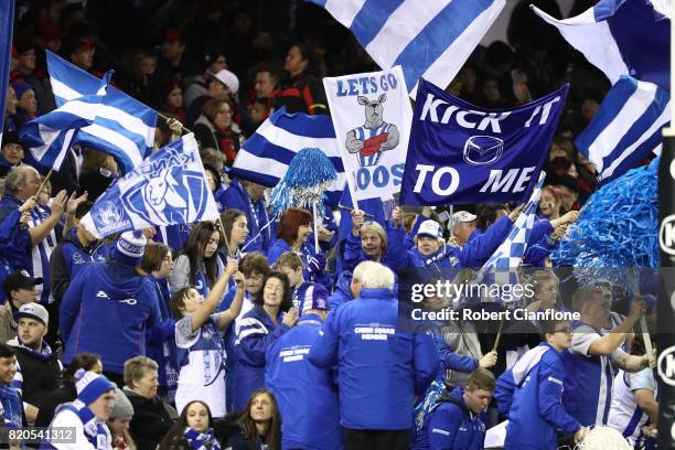 Fans cheer during the round 18 AFL match between the Essendon Bombers and the North Melbourne Kangaroos at Etihad Stadium on July 22, 2017 in...