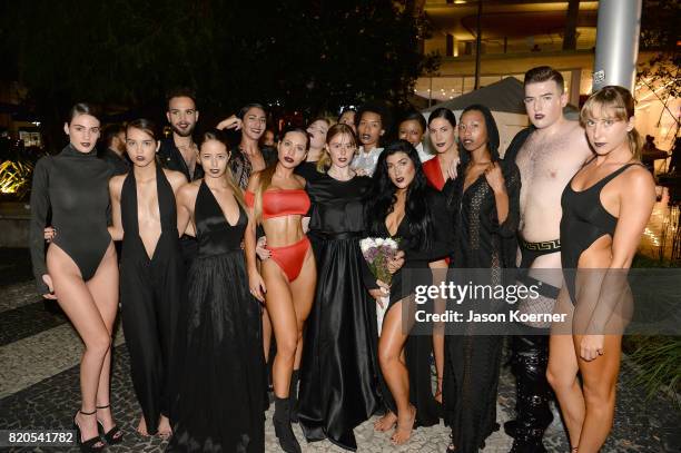 Designer Andrea Tankovitz poses with models at the "Tankovitz on Lincoln Road" event presented by DIVE Swim Week on July 21, 2017 in Miami, Florida.